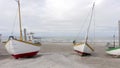 Old Fishing Boats Lined Up Ashore on Thorup Strand Beach in Denmark