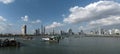 Old fishing boats near fish market in Panama City with skyline background