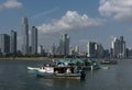 Old fishing boats near fish market in Panama City with skyline background