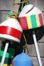 Old fishing buoys hanging on weathered coastal house Royalty Free Stock Photo