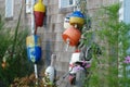 Old fishing buoys hanging on weathered coastal house Royalty Free Stock Photo