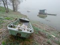 Old fishing gear looks lonely and abandoned in still and silent fog.
