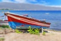 Old fishing red and blue boat tied on dock Royalty Free Stock Photo