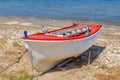 Old fishing red and white boat tied on dock Royalty Free Stock Photo