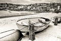 Old fishing rowing boat abandoned in the harbour in Cornwall Royalty Free Stock Photo