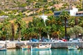 Scenic views of the bays of Loutraki, Greece, where old fishing schooners, boats and boats moor in the clear waters of the Ionian