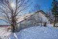 Old Fishing Shack Along Shore of Lake Superior Winter Into the Sun Royalty Free Stock Photo