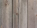 old flaked peeled weathered light yellow gray brown paint wood curve aged board planks background texture