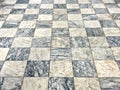 Old floor of light and dark marble squares