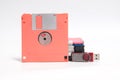 Old floppy disk and flash drive put on white background. Royalty Free Stock Photo