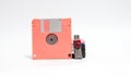 Old floppy disk and flash drive put on white background. Royalty Free Stock Photo