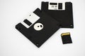 Old floppy disks and memory card on white background Royalty Free Stock Photo