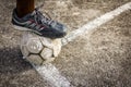 Old Football On Concrete Field