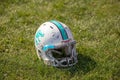 Old Football Helmet at the Stadium on the grass Royalty Free Stock Photo