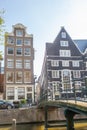 Old Footbridge Over a Canal in Sunny Amsterdam Royalty Free Stock Photo