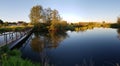 Old footbridge over the pond Royalty Free Stock Photo