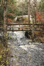 Old footbridge over a stream in small upstate New York town Royalty Free Stock Photo