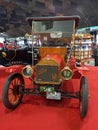 Old 1912 Ford Model T open runabout roadster on a red carpet. Font view. Classic car show.