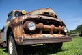 Rusty old ford truck with blue sky background Royalty Free Stock Photo