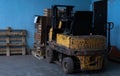 Old forklift, workshop, yellow closeup