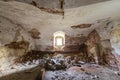 Old forsaken empty basement room of ancient building or palace with cracked plastered brick walls, low arched ceiling, small Royalty Free Stock Photo