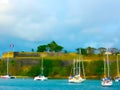 Old Fort in the capital of Fort de France, Martinique, with boats moored in the harbor below Royalty Free Stock Photo