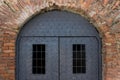 Old fortress door with armored metal sheets