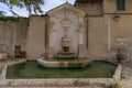 Old fountain Fontana del Mascherone on the wall of the thirtee Royalty Free Stock Photo