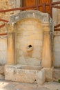Old fountain in Hersonissos. Royalty Free Stock Photo