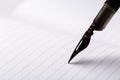 Old fountain pen with clipping path write on white paper background Royalty Free Stock Photo