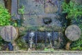 Old fountain poursing water from two spouts Royalty Free Stock Photo