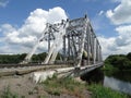 A freight train passed over the iron bridge