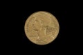 An old French franc coin isolated on a black background Royalty Free Stock Photo