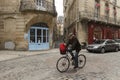 Old man on a bike in the French city of Bordeaux
