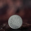 Old french money : French money coin one franc on dark background Royalty Free Stock Photo