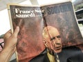Old 1970 french newspaper with Charles de Gaulle portrait, hand holding old french newspapaer in his hand