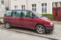 Old purple red Peugeot 806 van right side view