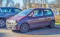 Old French small purple red car Renault Twingo left side front view Royalty Free Stock Photo