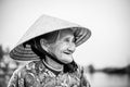 Old friendly woman with vietnamese straw hat