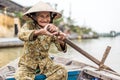 Old friendly woman with vietnamese straw hat