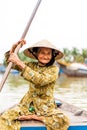 Old friendly woman with vietnamese straw hat