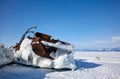 Old frozen ship on the bank of Olkhon island on lake Baikal