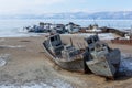 Old frozen ship on the bank of Olkhon island on siberian lake Baikal