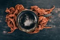 An old frying pan on a wooden background. Royalty Free Stock Photo