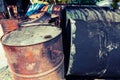 Old fuel tanks that lay altogether processed in vintage style Royalty Free Stock Photo