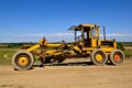 Old functional yellow road grader Royalty Free Stock Photo