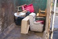 Old furniture and chairs rubbish in steel container for charity jumble sale at recycle centre