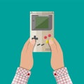 Old Gadget. Handheld game console in hands Royalty Free Stock Photo