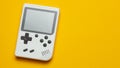 Old game console. Gamepad is white on a yellow background. Copy space for text Royalty Free Stock Photo