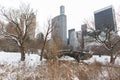 The Old Gapstow Bridge at Central Park with the Midtown Manhattan Skyline during the Winter with Snow in New York City Royalty Free Stock Photo